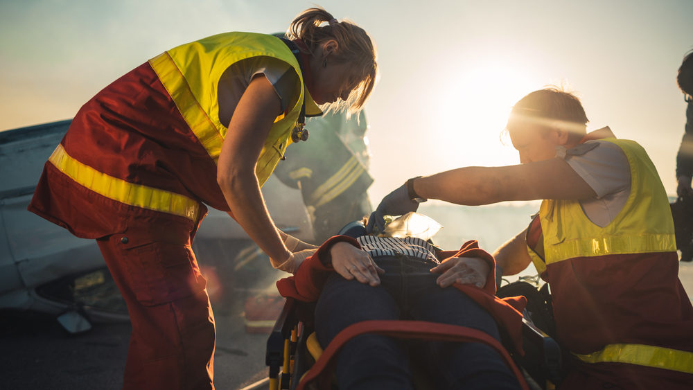 Personal Injury vs Bodily Injury Paramedics Saving Life of a Female Victim who is Lying on Stretcher