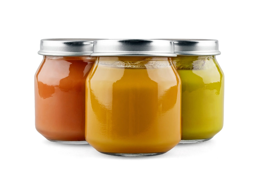 Plaintiffs Sue Baby Food Manufacturers After Toxic Heavy Metals Found in Products Three jars of baby food on white background