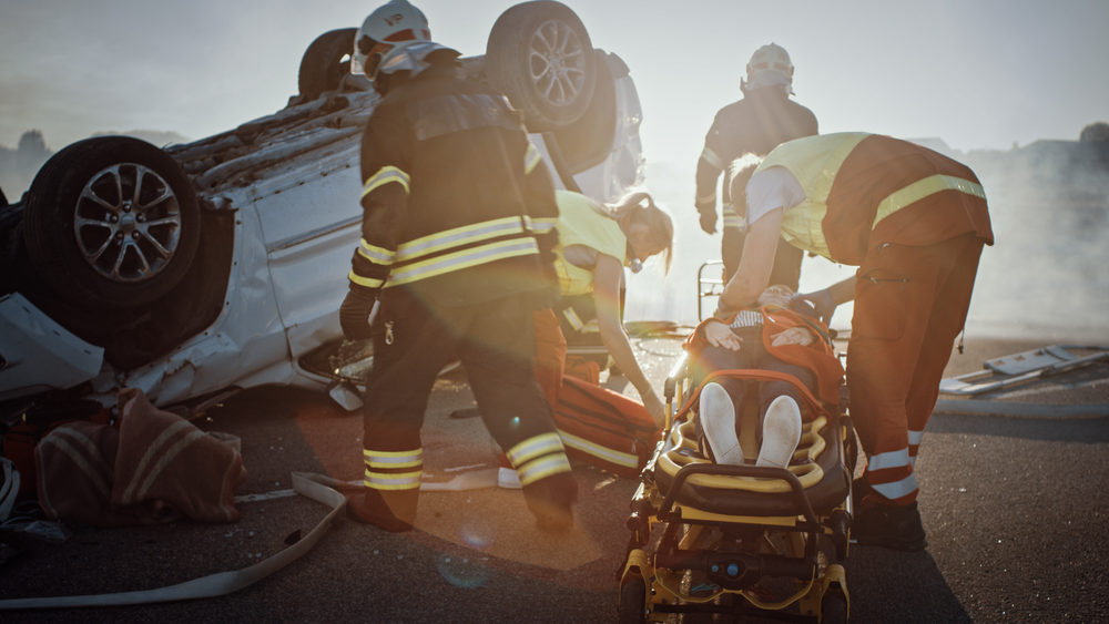 Hwy 101 Rollover Causes Multiple Injuries near Soledad in Monterey County emergency response team at the site of a car crash