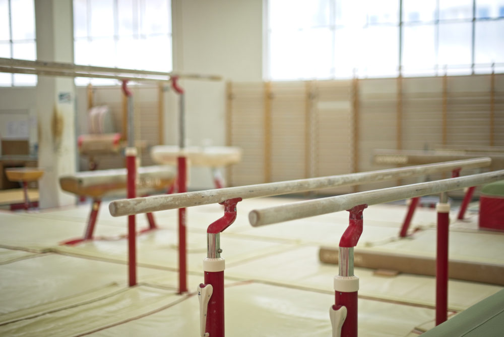 Trousdell Gymnastics Center Coach Taniya Colson Arrested for Child Sexual Battery Charges Gymnastic equipment in a training room