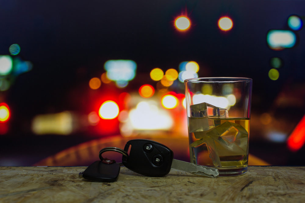 Paso Robles PD Search for Driver Responsible for Rollover Crash at Caballo Pl, Calle Chorro keys and an alcoholic beverage with car lights in background