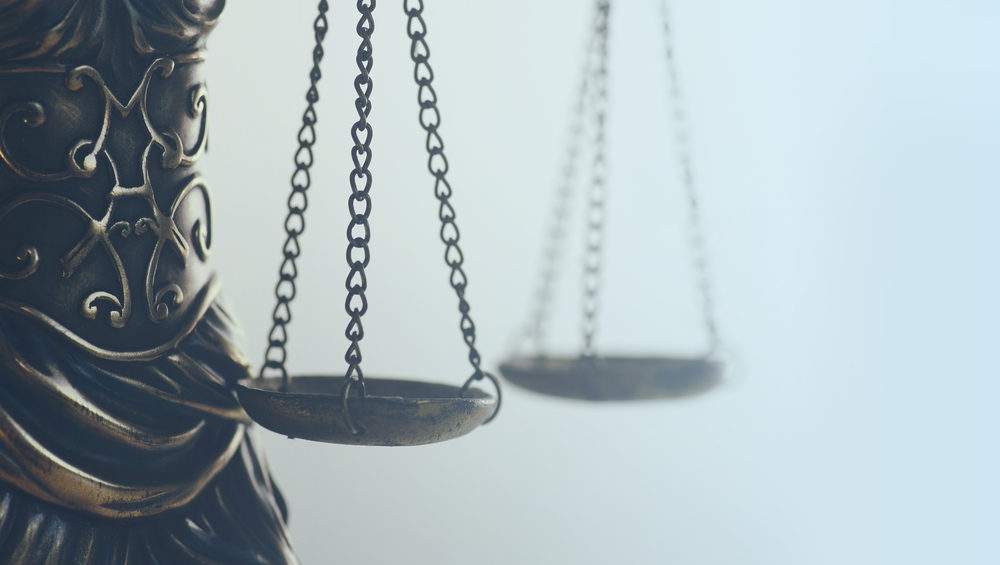 New York Passes Law to Give Adult Sexual Abuse Survivors a Chance for Justice abstract close up detail of scales of justice