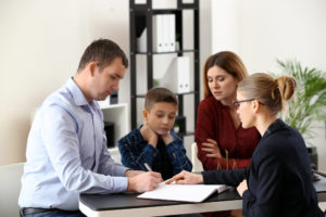 Child Custody and Support in Florida – How It Works Divorced parents with their son visiting lawyer.