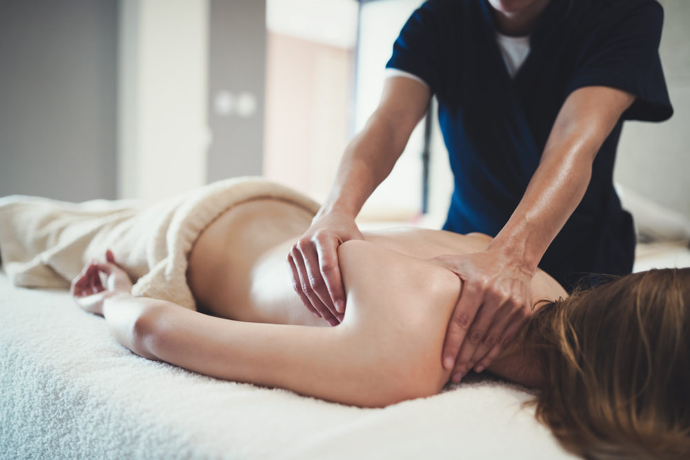 Arrest of DFW Airport Massage Therapist, Zantana Zuniga, on Sexual Abuse Charges Raises Alarms Over Client Safety Massage therapist squeezing the shoulder blade of a face-down woman at a spa