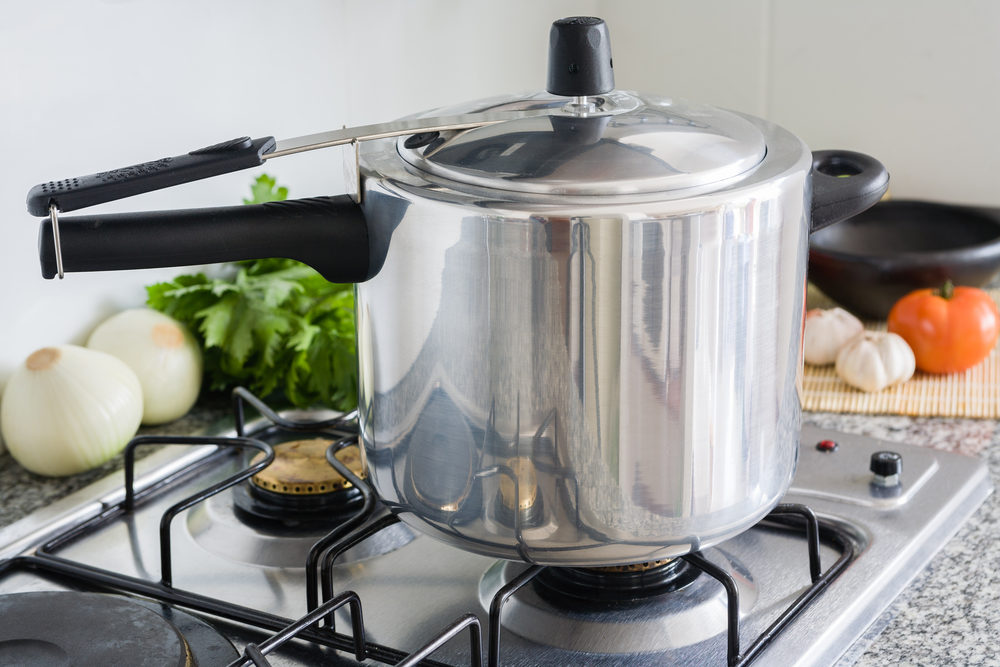 Woman Burned While Toddler Narrowly Escapes Exploding Pressure Cooker Pressure Cooker in a Kitchen setting