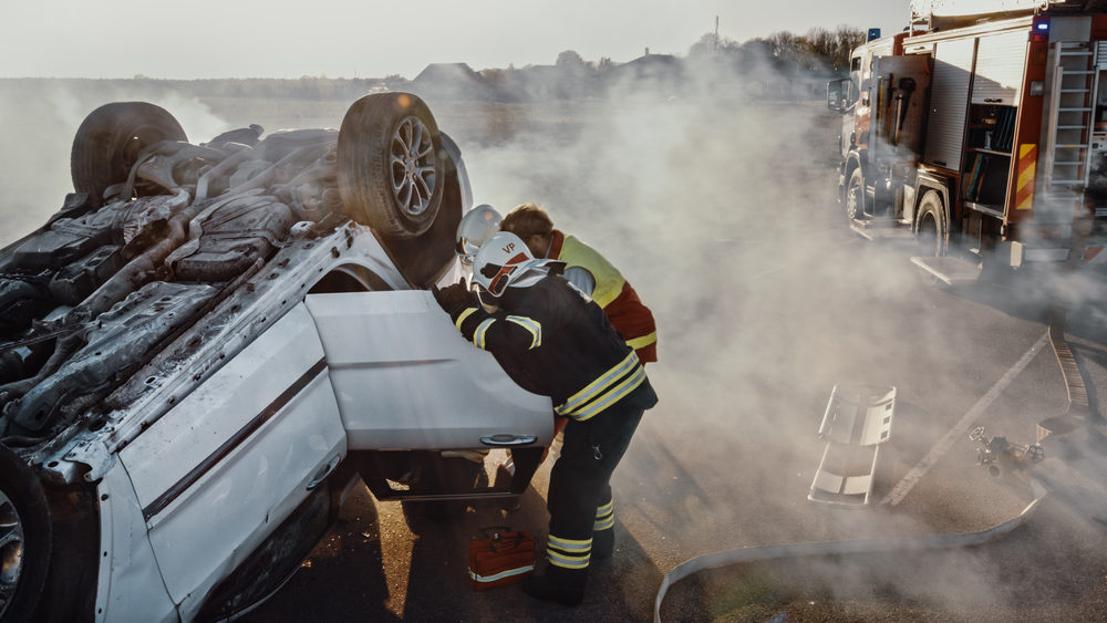 Compensation Considerations In Catastrophic Injury Cases Firefighters Pull Female Victim out of Rollover Vehicle