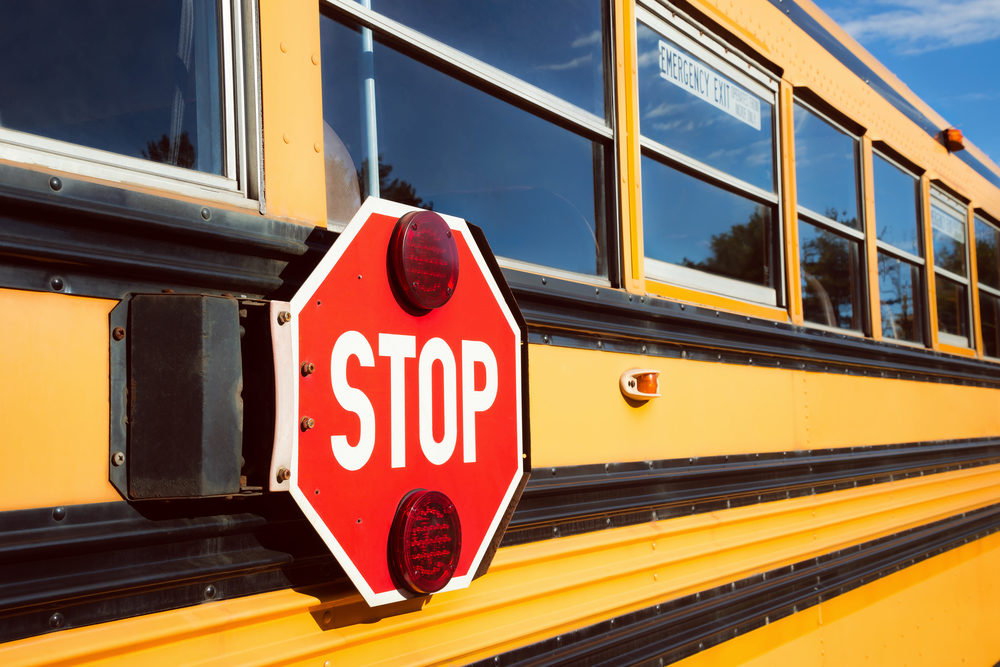 Florida Bus Driver Charles Buono Arrested After Student’s Abuse Report Leads to Investigation in Walton County School District Stop sign with red lights on the side of the school bus