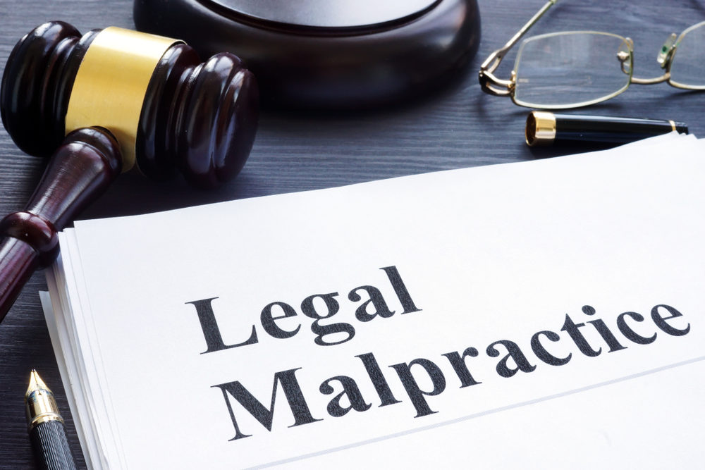 Legal Malpractice: How Do I Know If I Have A Case? "Legal Malpractice" document on a desk with a gavel