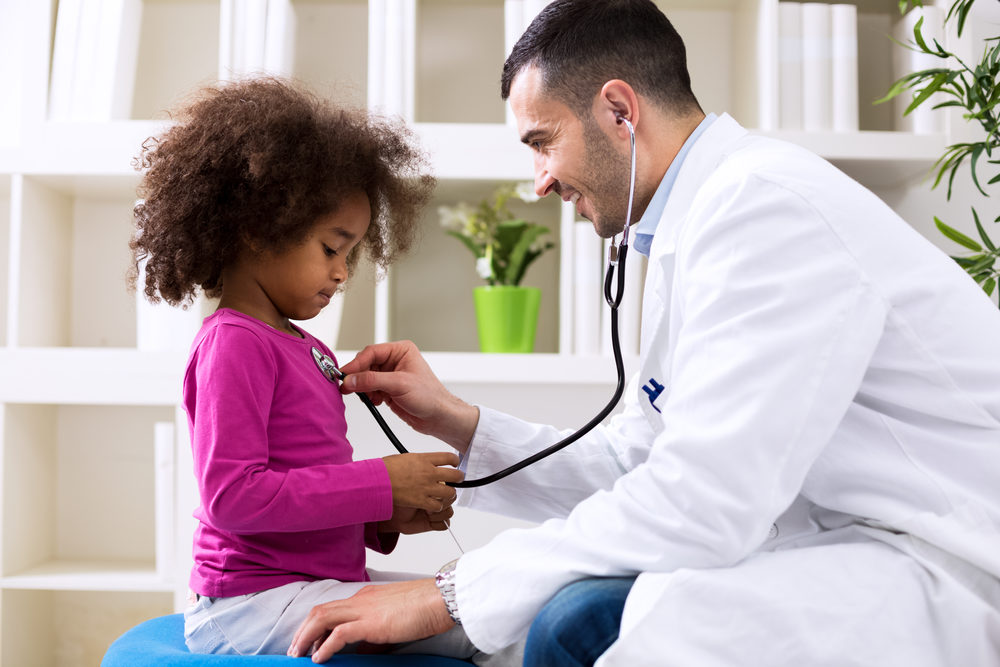 Irving Little Spurs Pediatrics Pediatric Medical Assistant Arrested for Child Molestation A young male doctor listens to a little girl's heart with a stethoscope