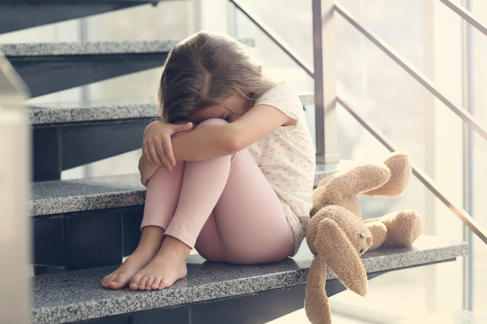 Washington Pays $15M in Foster Care Abuse Settlement | Centralia Case Exposes Systemic Failures Little girl crying on a stairway