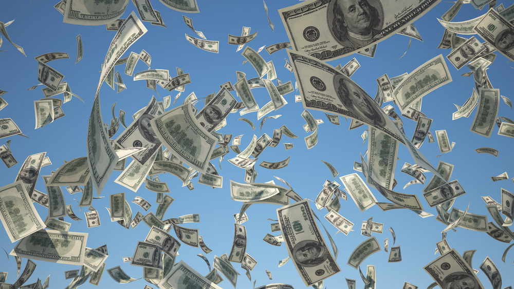 Big Unemployment Benefits Tax Break One hundred dollar bills raining from the sky
