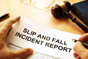 A SLIP AND FALL INCIDENT REPORT being filled out by an attorney
