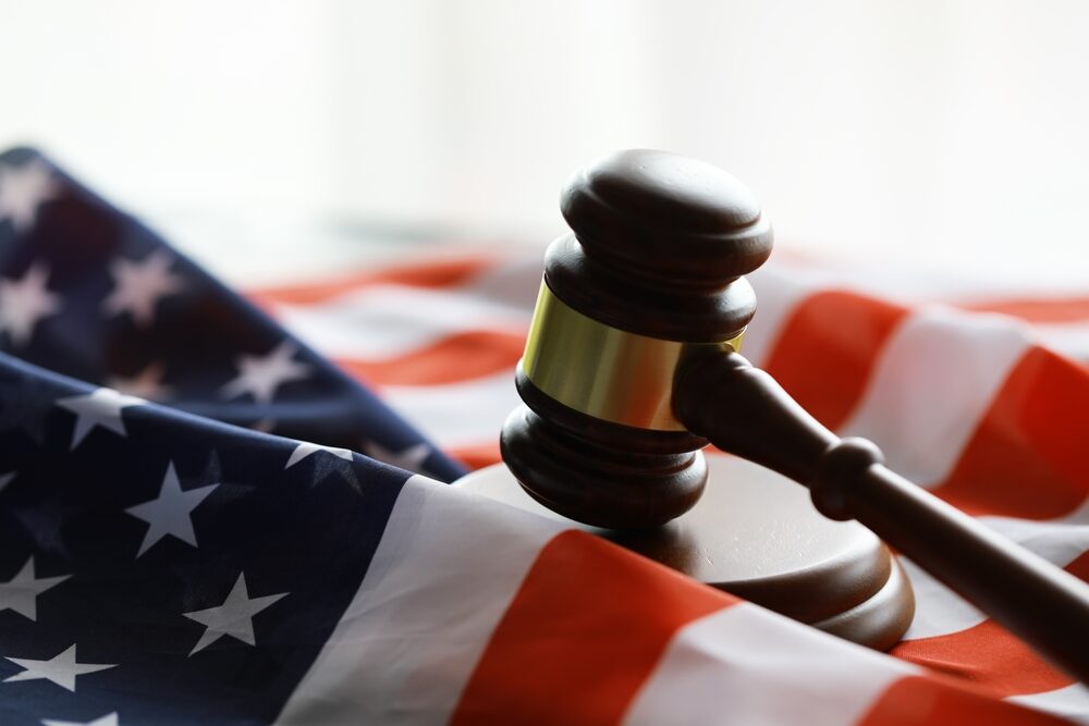 wooden gavel on an american flag closeup