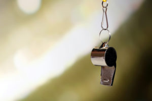 whistle closeup with abstract background