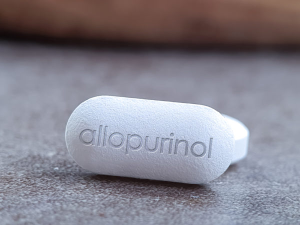 Allopurinol tablet close up of drug medication used to decrase high blood uric acid levels and to prevent gout and kidney stones and in chemotherapy