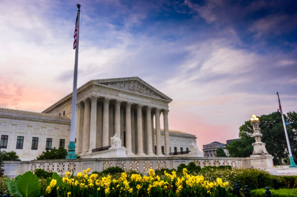 view of the us supreme court building in washington, d.c. at evening time