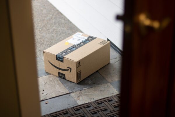 An Amazon Prime package delivered on a doorstep.